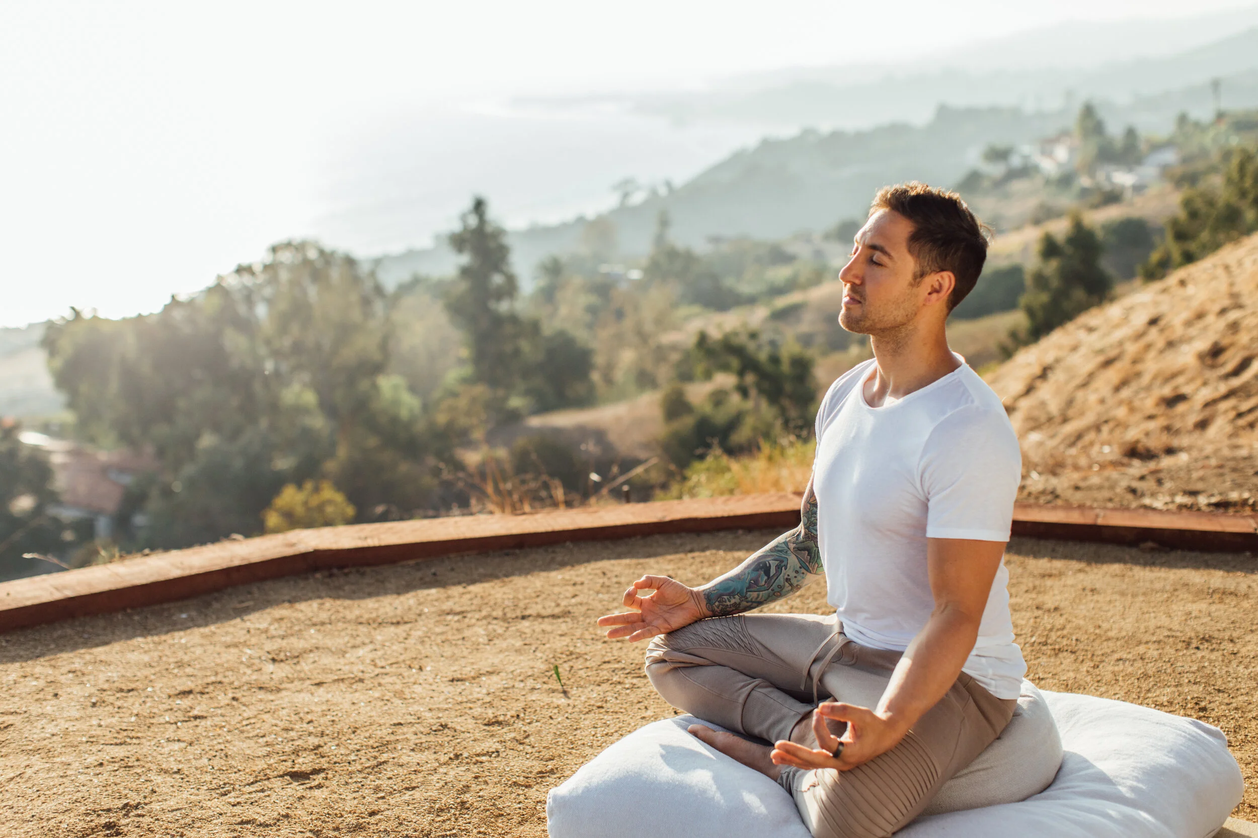 Person meditating outdoors