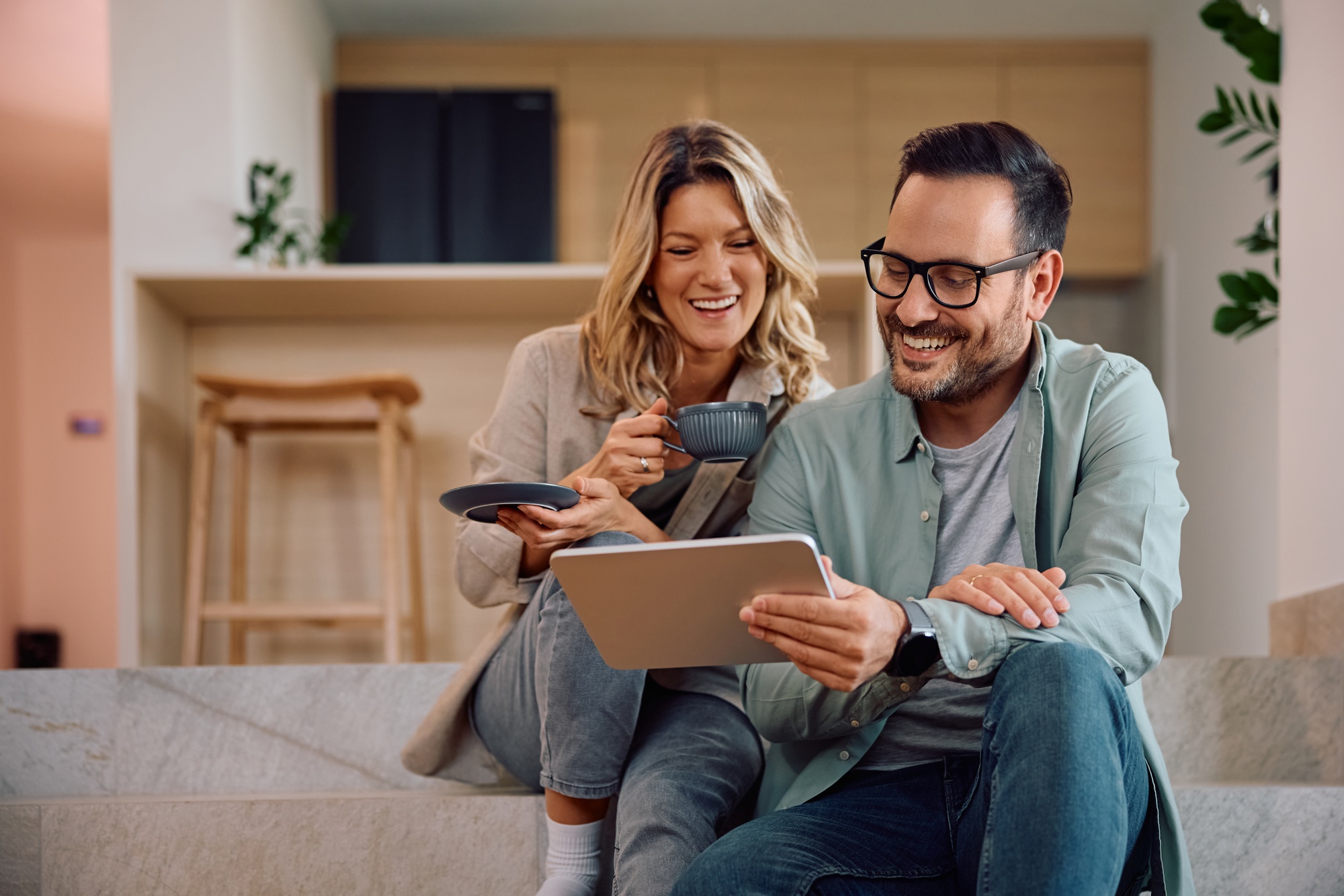 Family completing an intake on a tablet at home